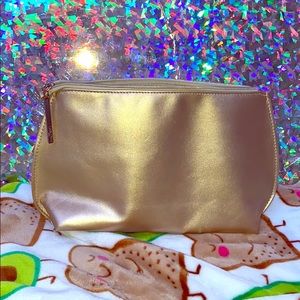 Golden Lancôme makeup bag